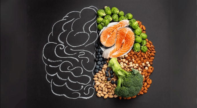 Brain health concept with omega-3 rich fish, nuts, berries, and fresh vegetables for balanced nutrition.