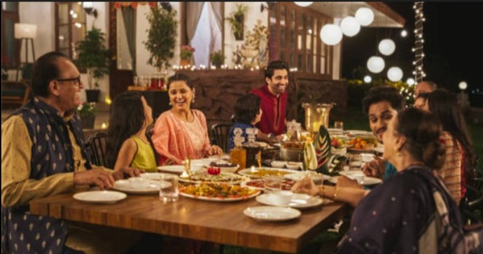Family enjoying a healthy meal together while sharing quality time in a warm dining setting.