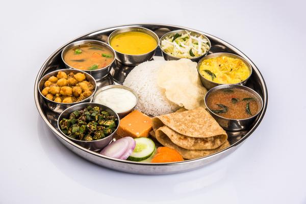 Healthy Indian balanced diet featuring roti, dal, sabzi, salad, curd, and wholesome nutritious foods.