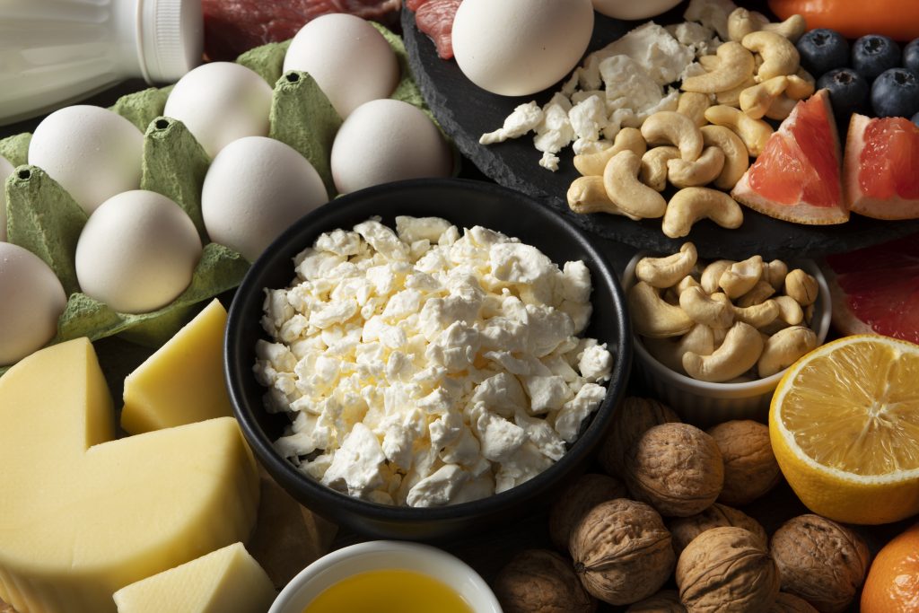 Calcium rich foods for women including milk cheese eggs nuts and healthy nutrition.